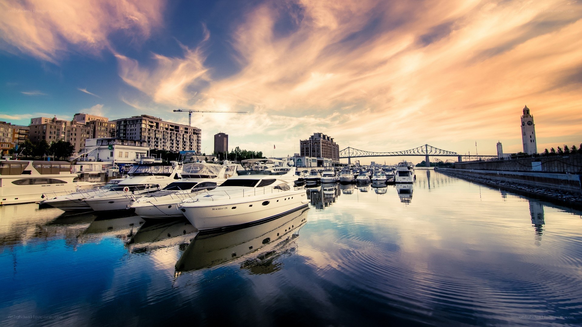 Boats docked at sunset