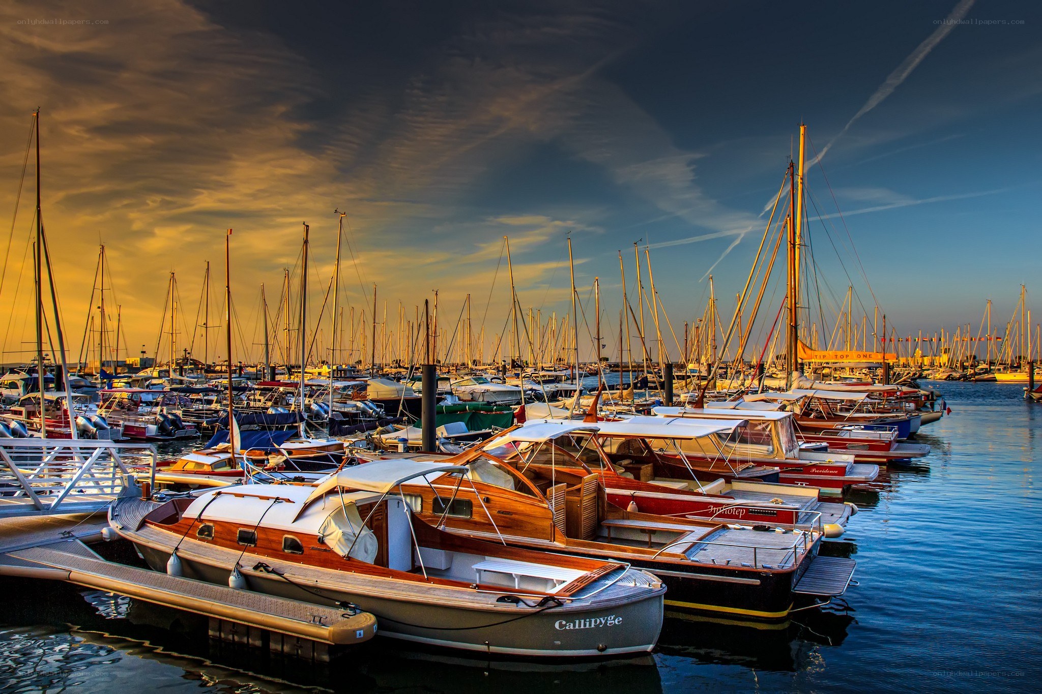 Boats docked at sunset