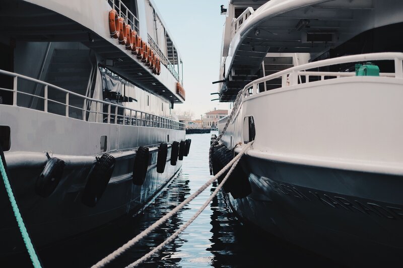 Boats docked in a narrow channel