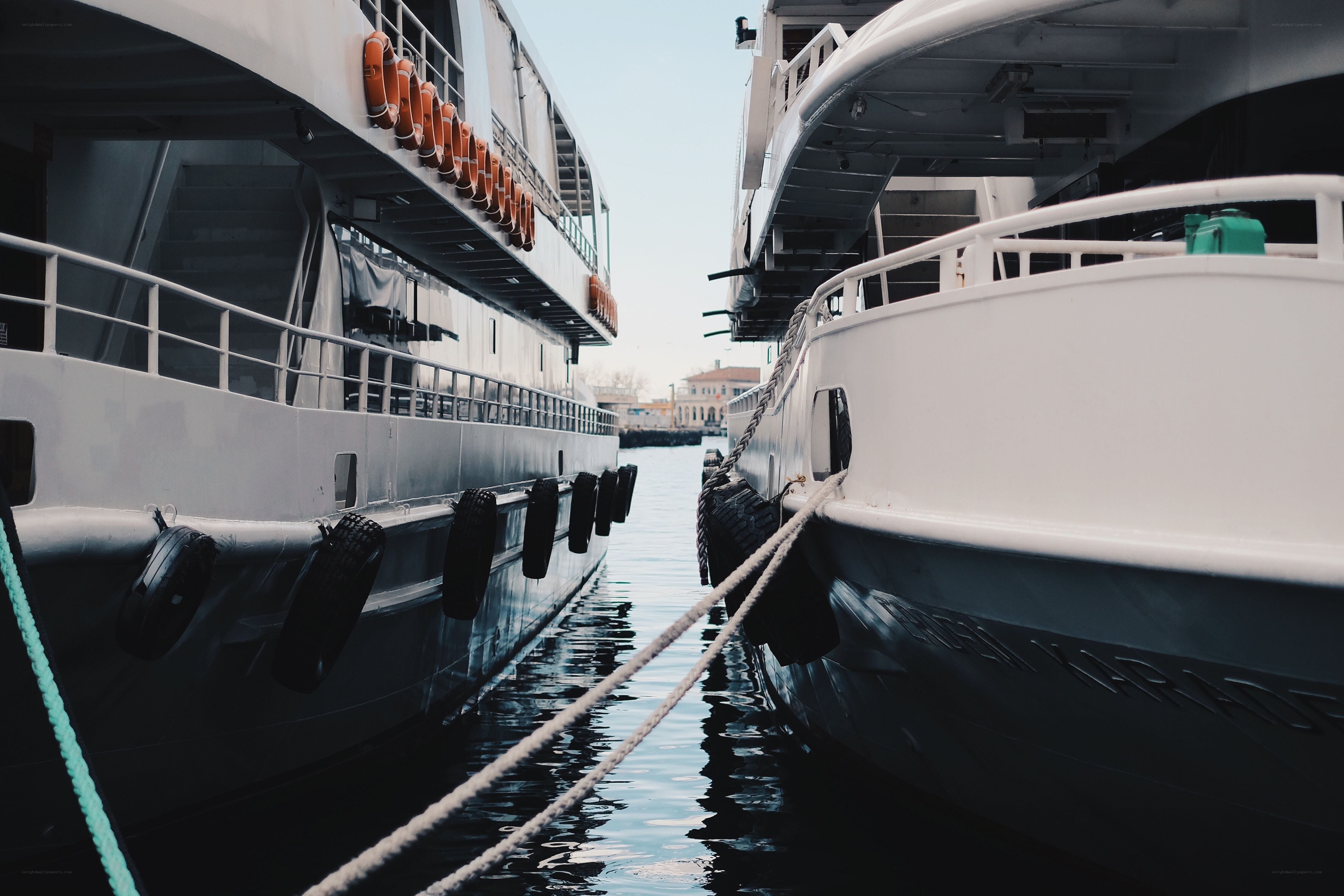Boats docked in a narrow channel