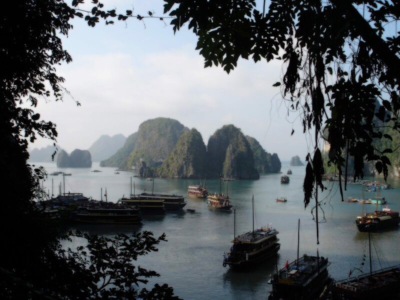 boats in a bay with karst islands