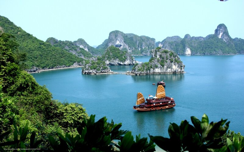 Boats in a bay with limestone islands