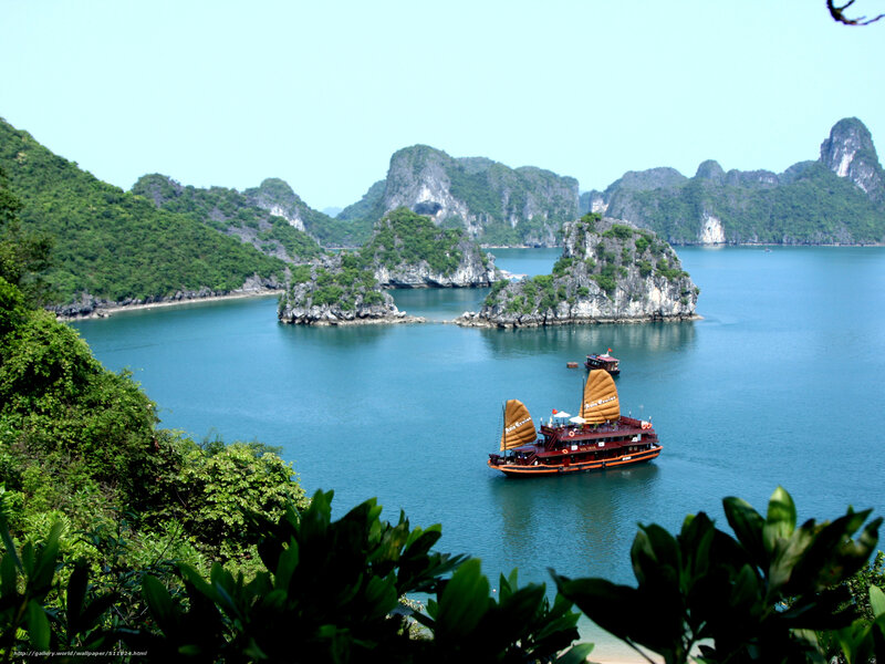 Boats in a bay with limestone islands