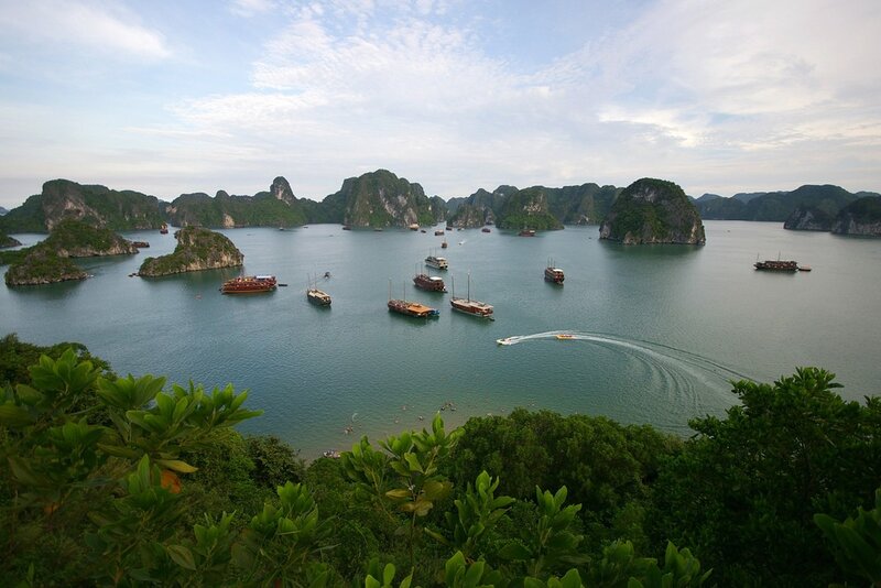 boats in a bay with limestone islands