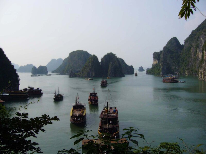 Boats in a bay with limestone islands
