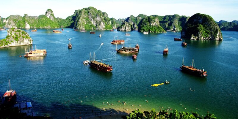 boats in a bay with limestone islands