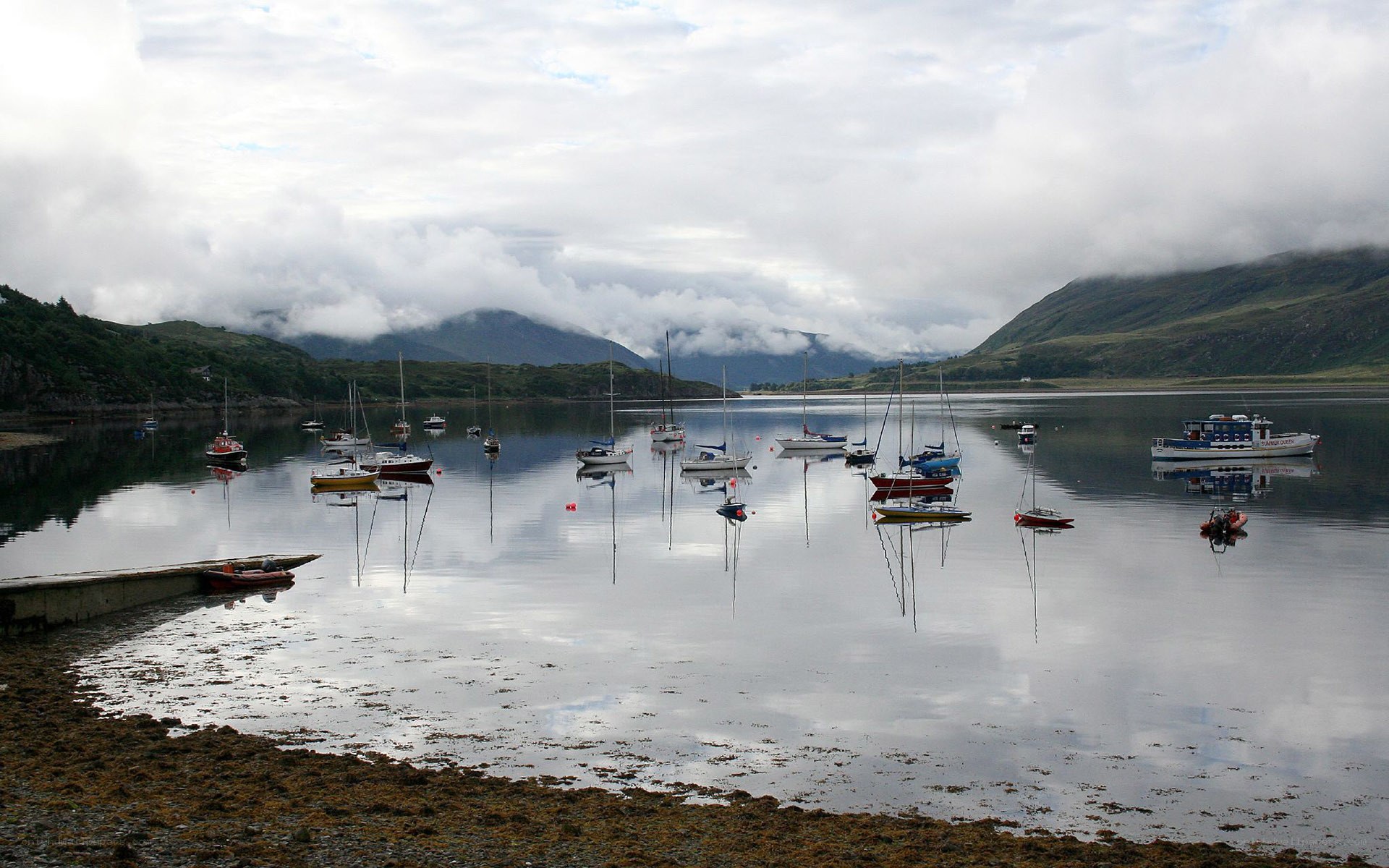 Boats in a calm Scottish loch