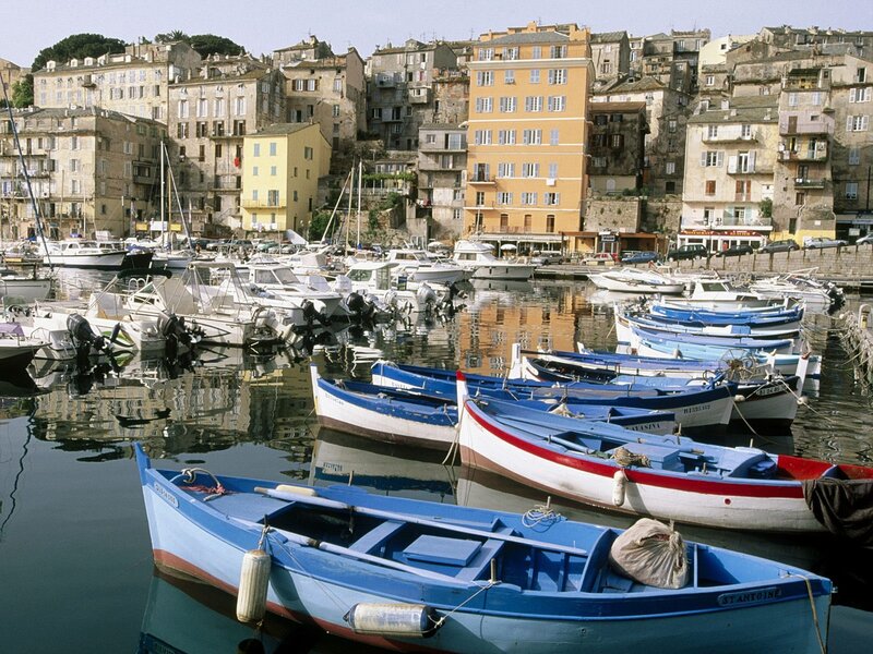 Boats in a coastal town harbor