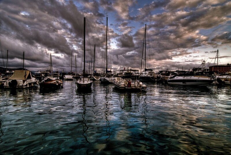 Boats in a harbor at dusk