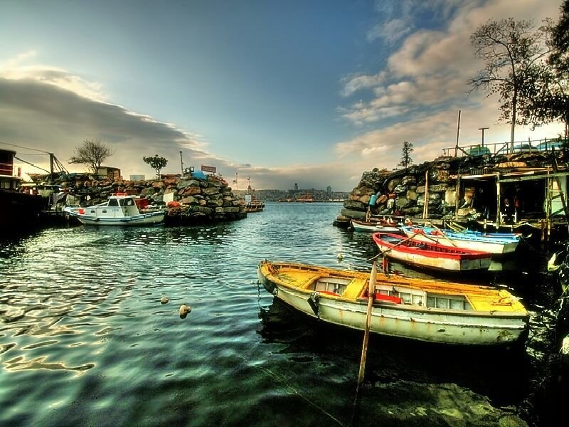 Boats in a harbor at dusk