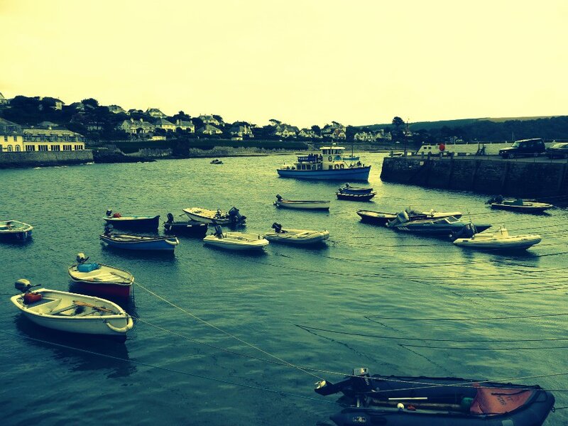 Boats in a harbor at dusk