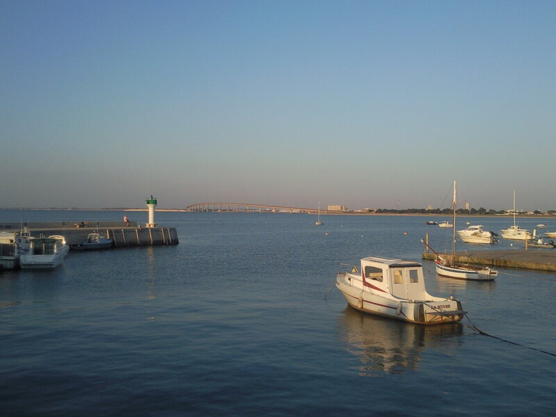 Boats in a Harbor — Blue, Calm, Afternoon, Photograph, Lighthouse