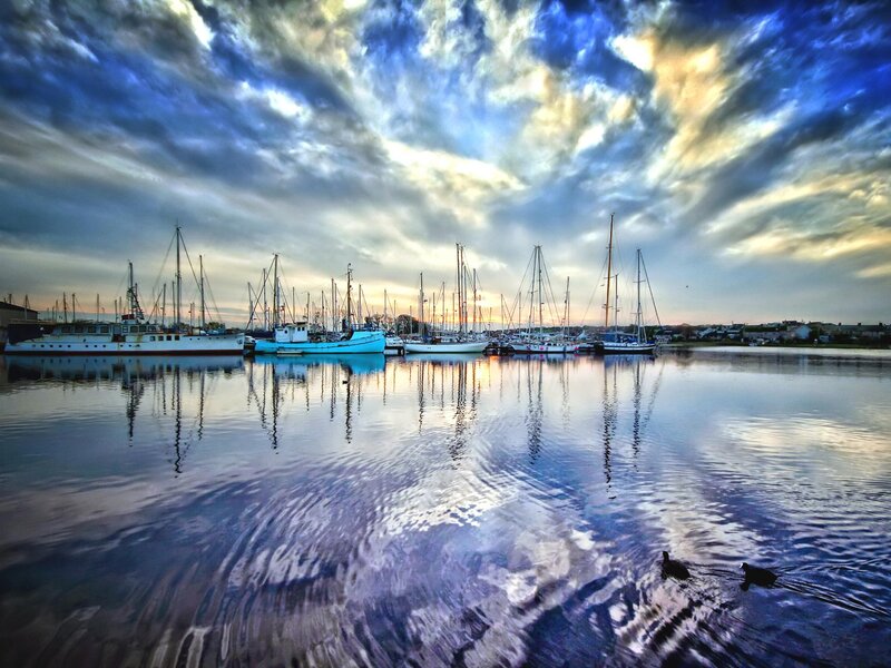 Boats in a Harbor — Blue, Dramatic, Sunset, Photograph, Clouds, Water