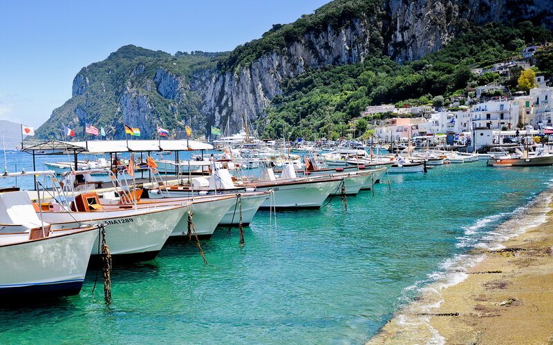 Boats in a Harbor — Blue, Serene, Afternoon, Photograph, Cliffs, Buildings