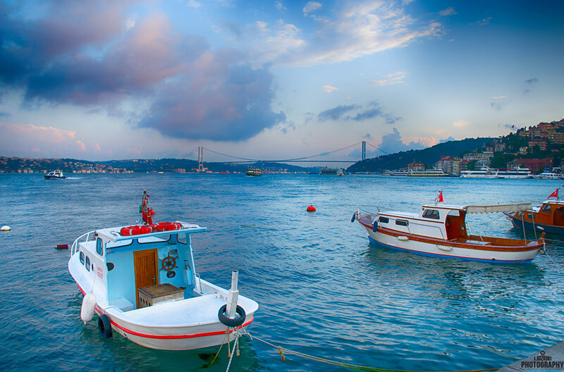 Boats in a Harbor — Blue, Serene, Sunset, Photograph, Bridge