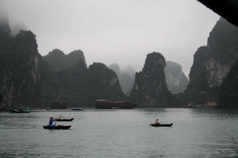 Boats in a misty bay