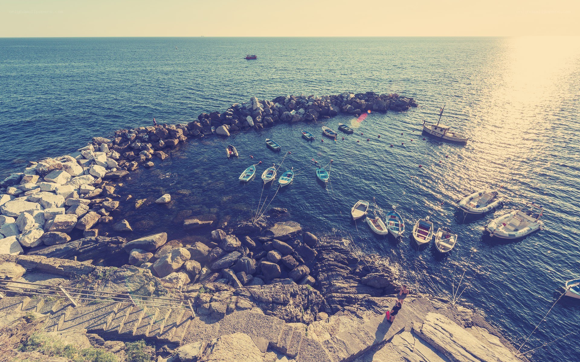 Boats in a rocky harbor