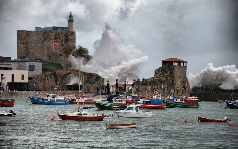 Boats in a Stormy Harbor