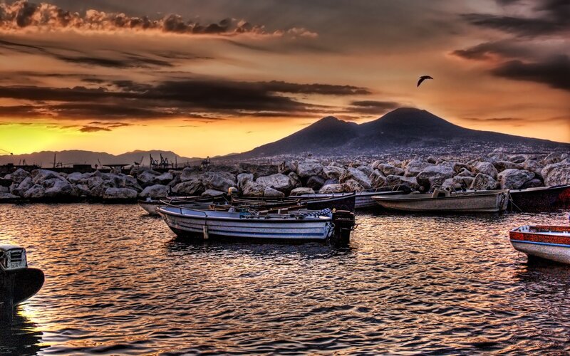 Boats in Harbor at Sunset — Orange, Dramatic, Photograph, Mountain, Seagull, Rocks, City
