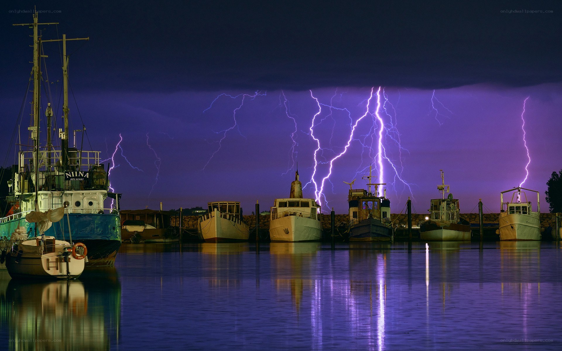 Boats in stormy harbor