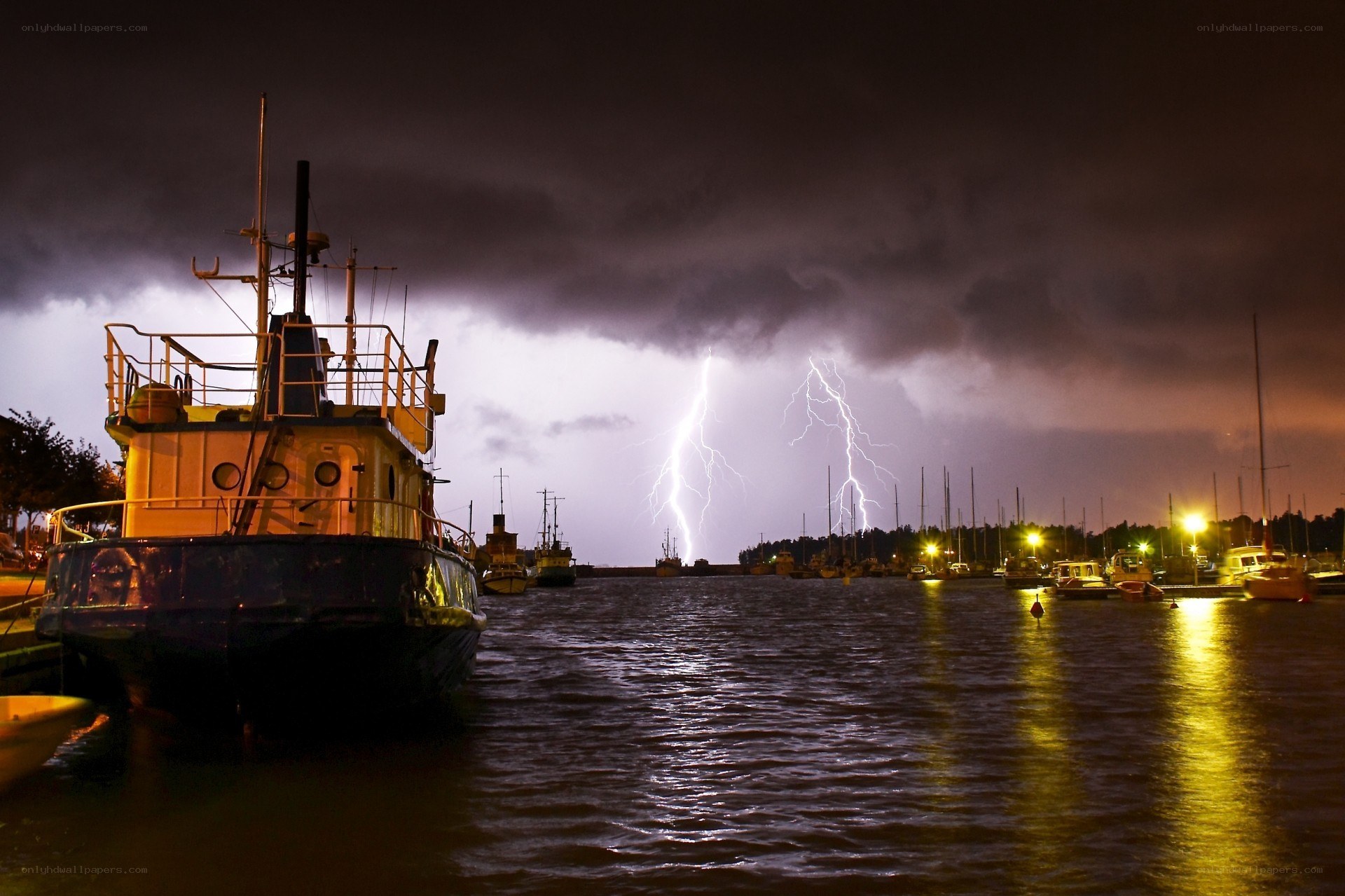 Boats in stormy harbor