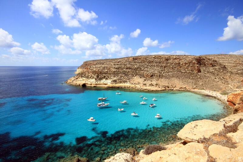 Boats in Turquoise Cove — Blue