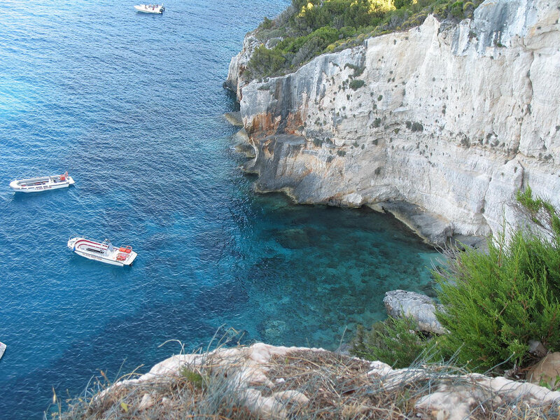 Boats near a coastal cliff
