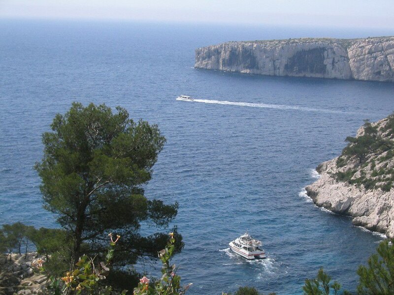 Boats near coastal cliffs