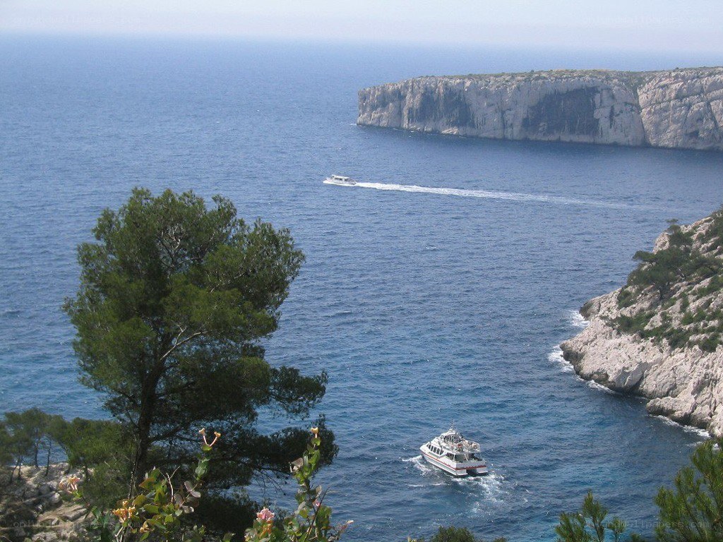 Boats near coastal cliffs