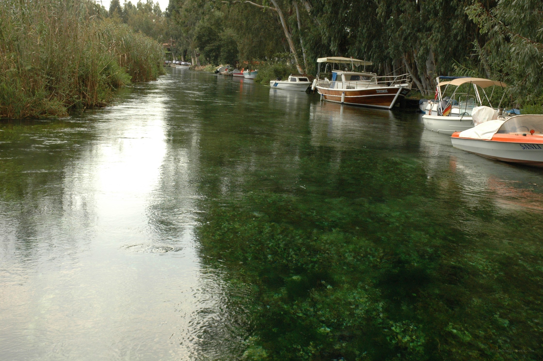 Boats on a clear river