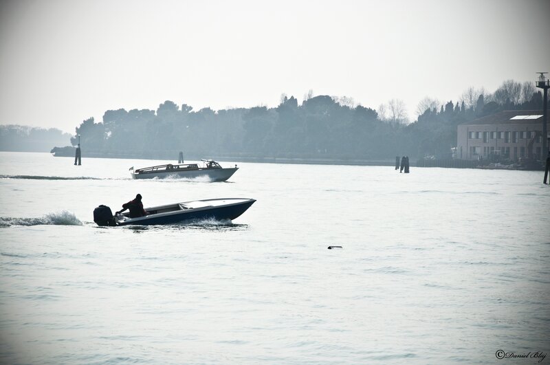Boats on a hazy waterway