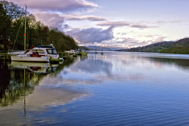 Boats on a lake at dusk