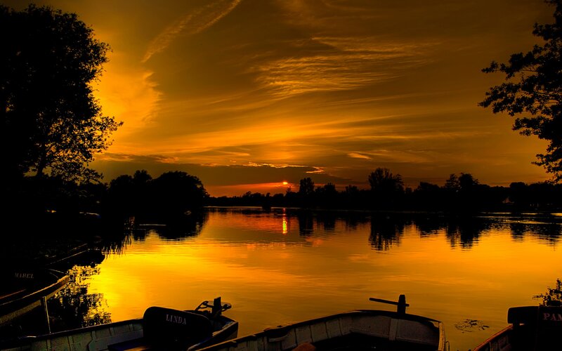 Boats on a Lake at Sunset — Orange, Serene