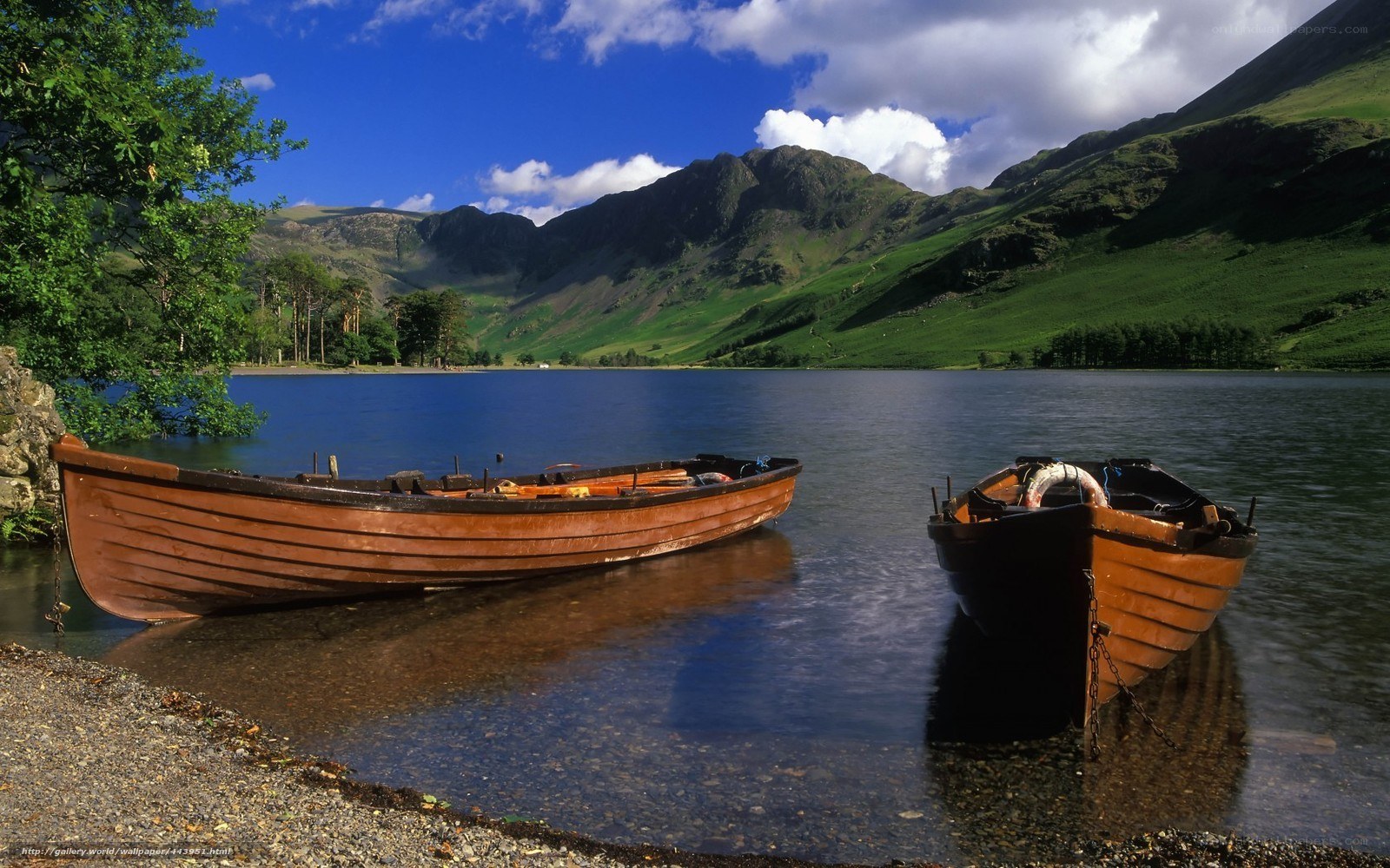 Boats on a lake with mountains