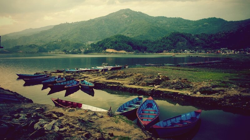 Boats on a lake with mountains