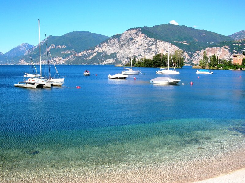 Boats on a lake with mountains