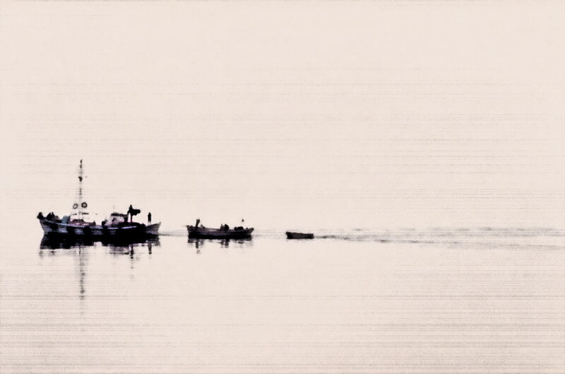 Boats on a misty sea