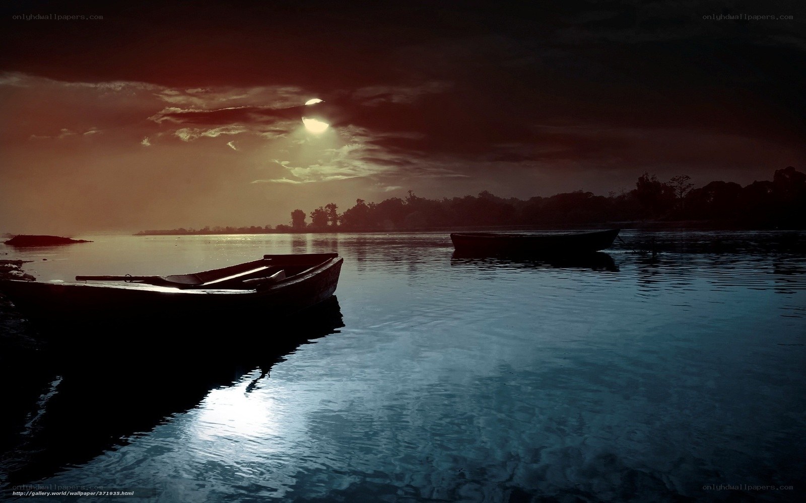 Boats on a moonlit lake