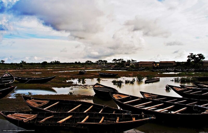 Boats on a muddy riverbank