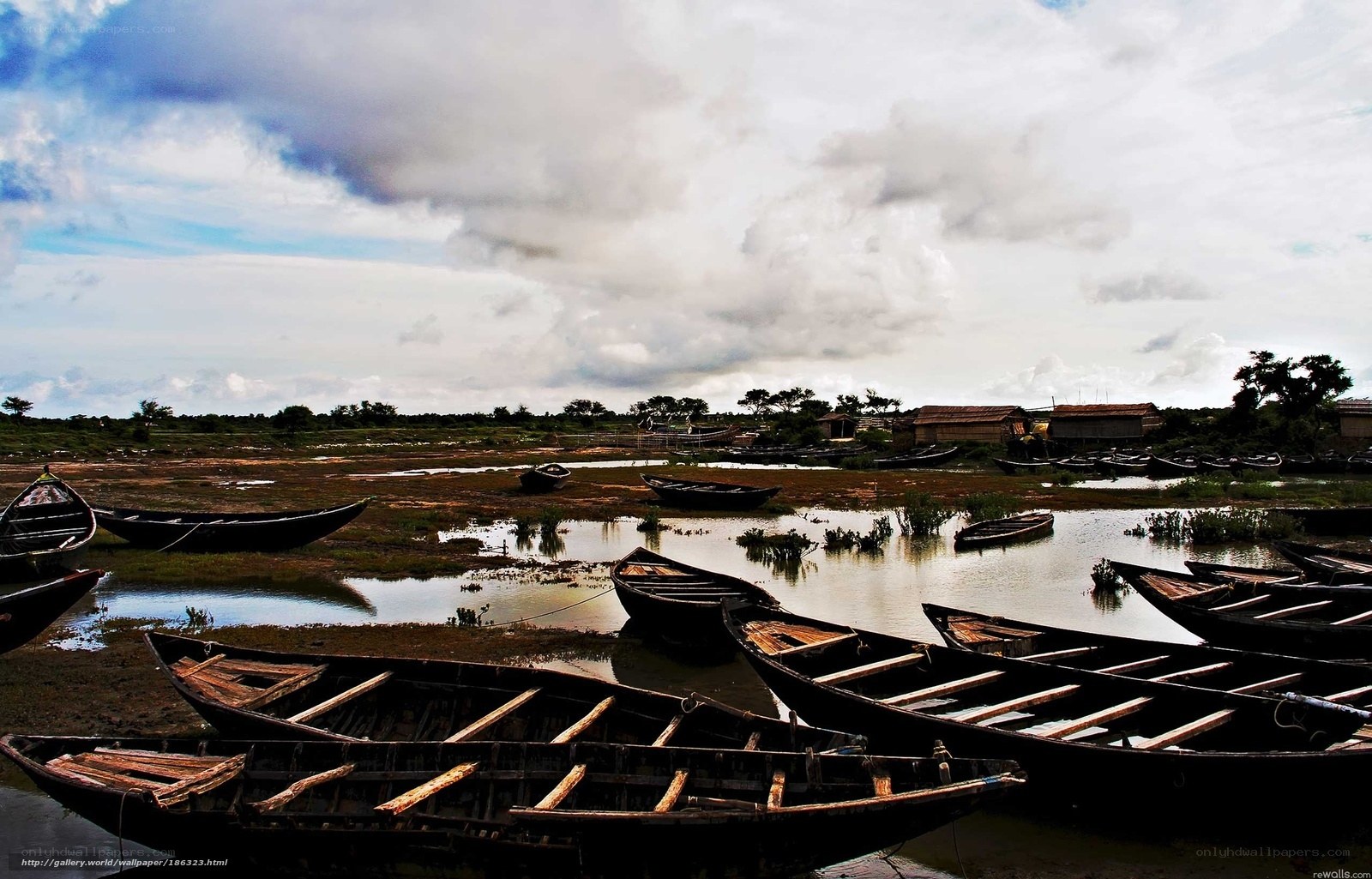 Boats on a muddy riverbank