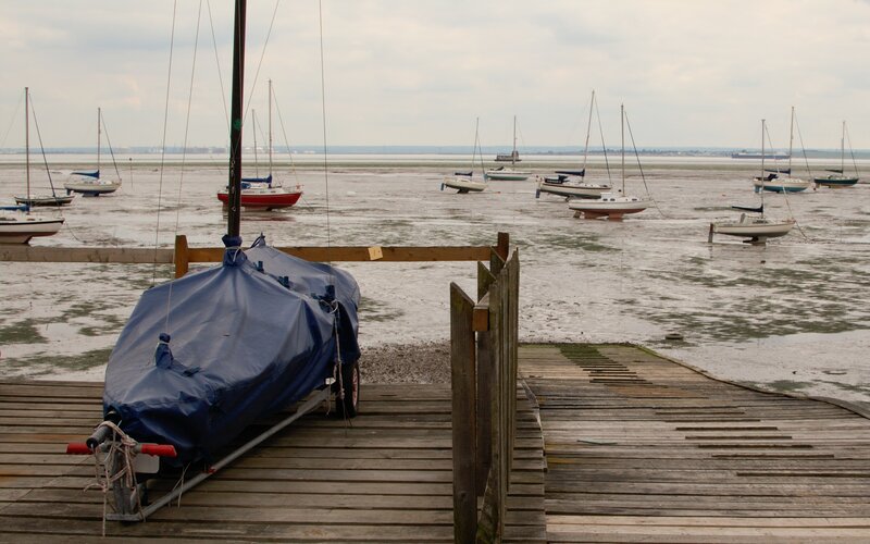 Boats on a muddy shore