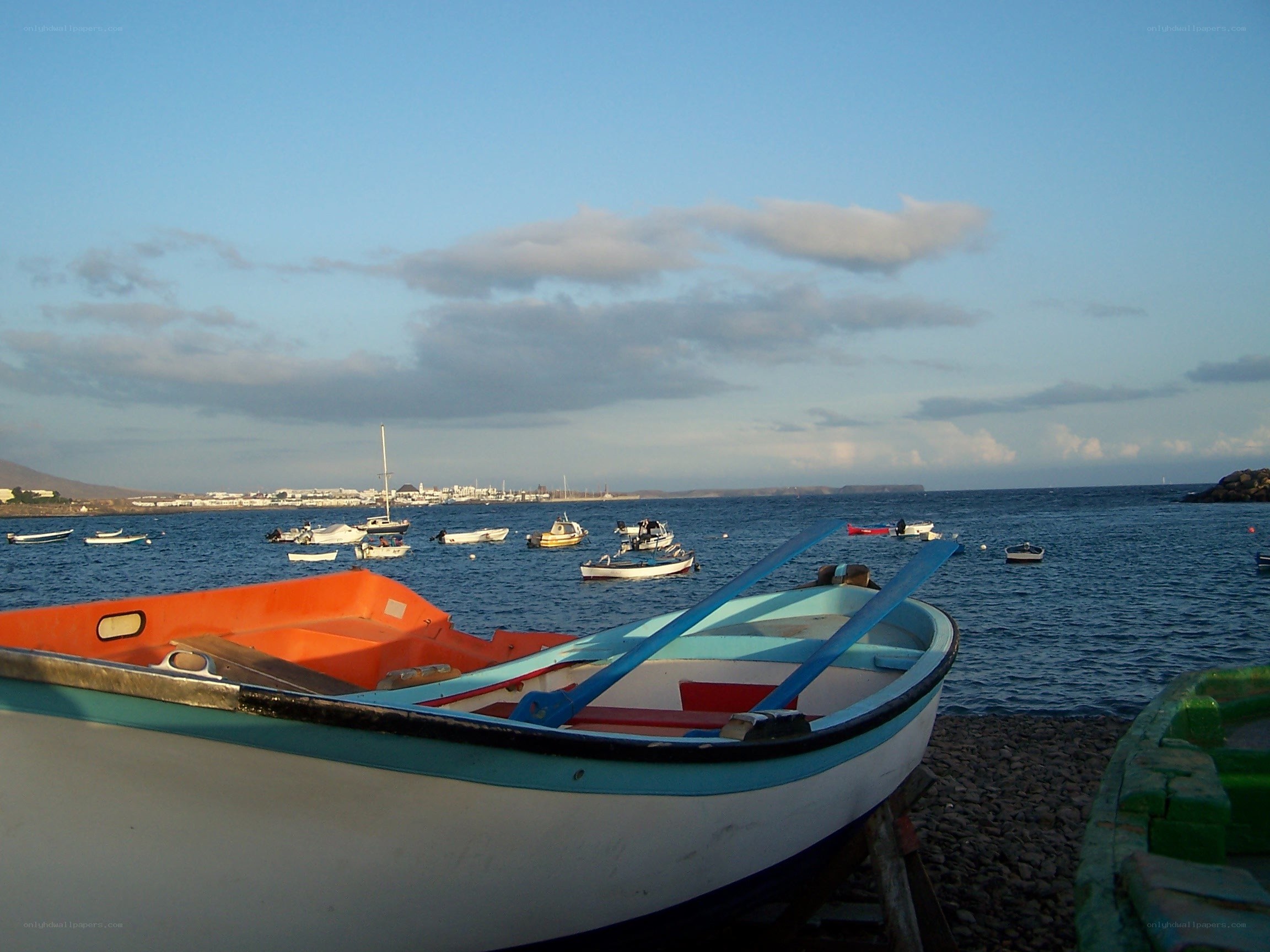 Boats on a pebble beach
