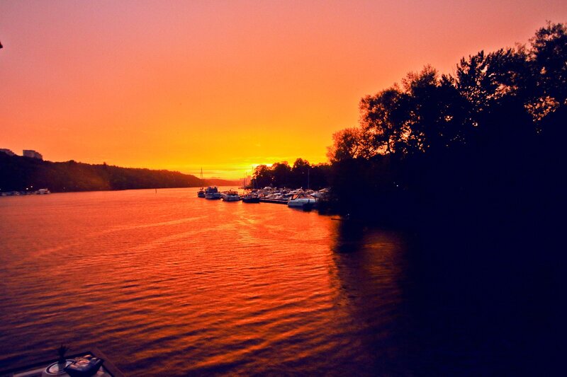 Boats on a River at Sunset — Orange