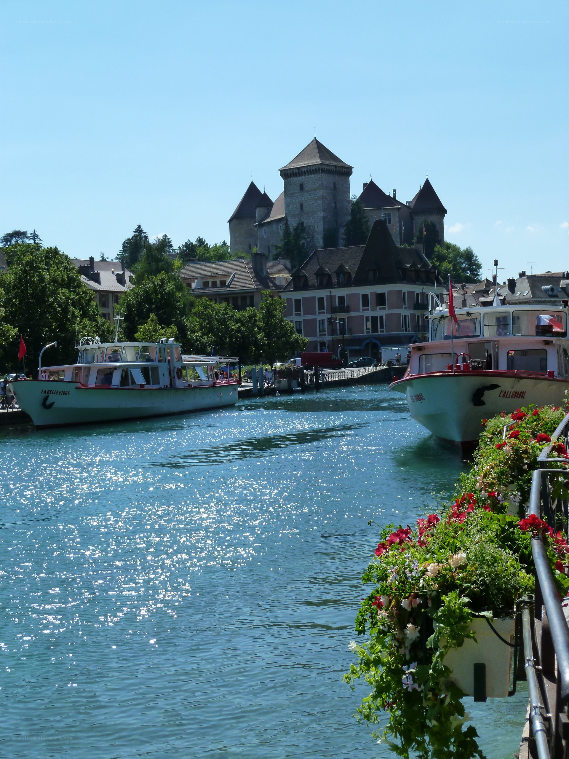 Boats on a river with castle