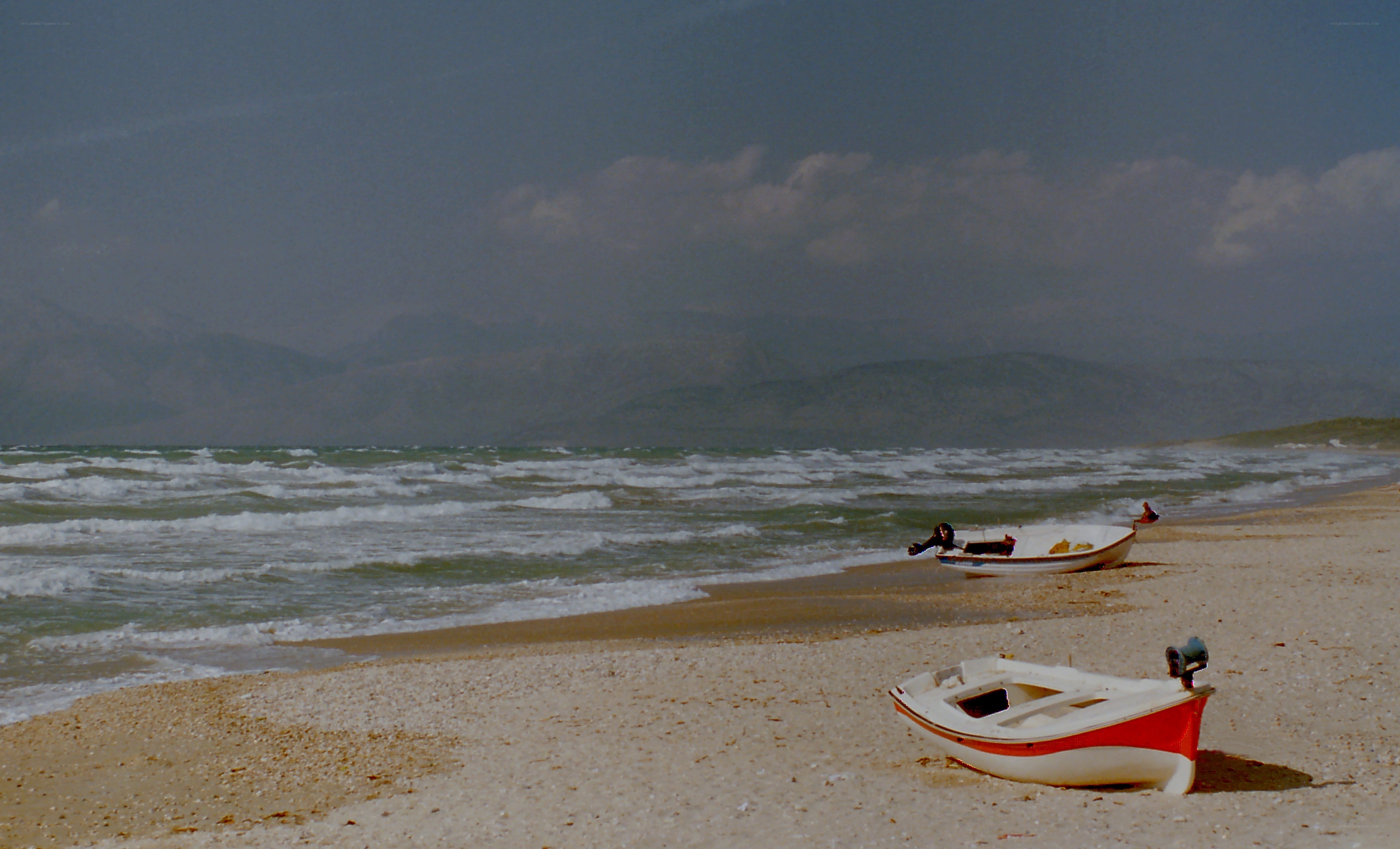 Boats on a stormy beach