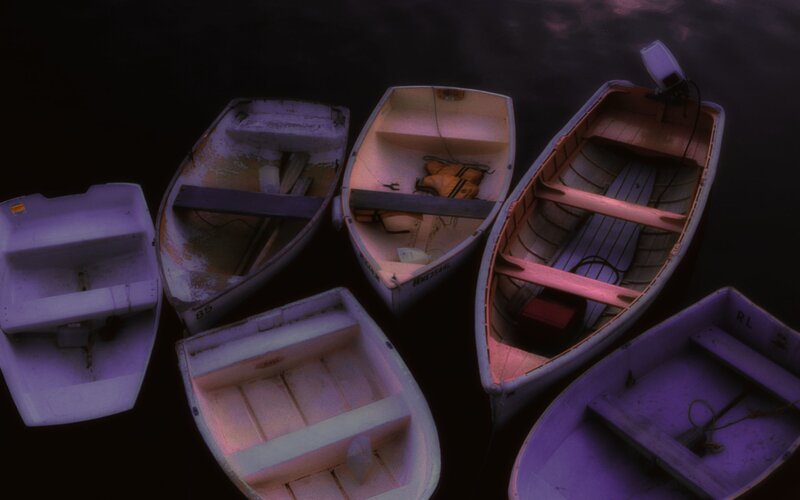 Boats on dark water at night