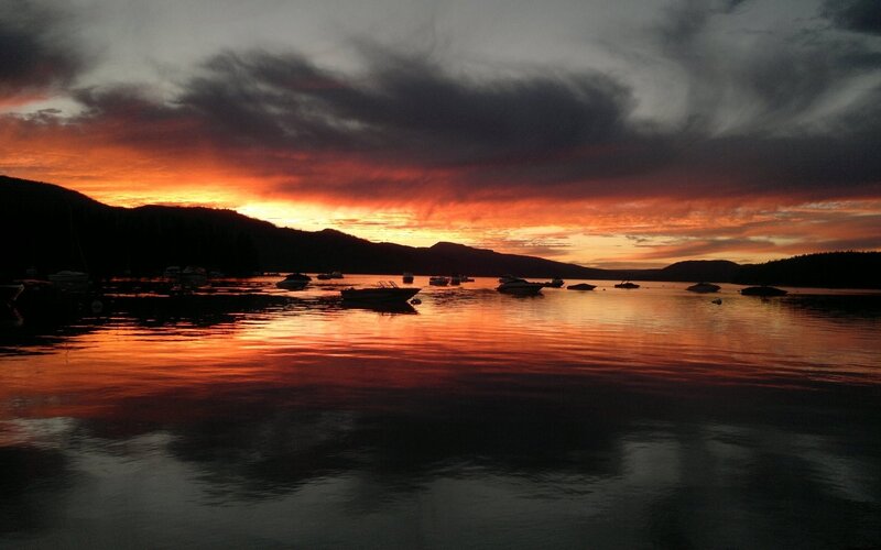 Boats on Lake at Sunset — Orange, Dramatic, Photograph, Mountains, Sky