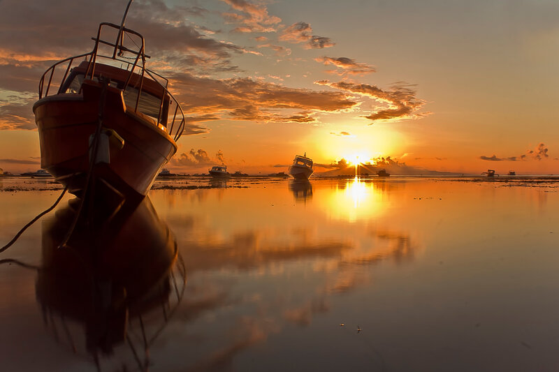 Boats on Wet Sand