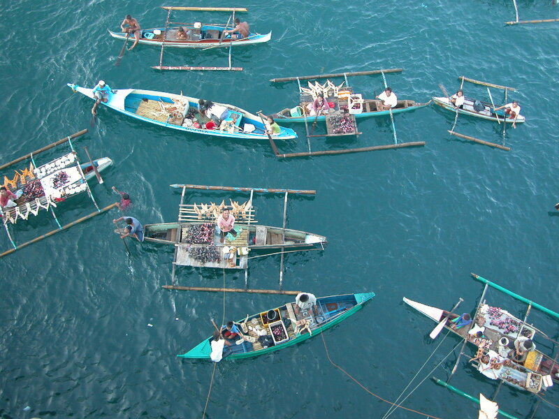 Boats selling goods on water