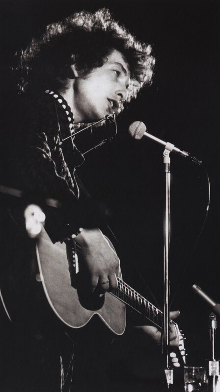 Bob Dylan performing on stage